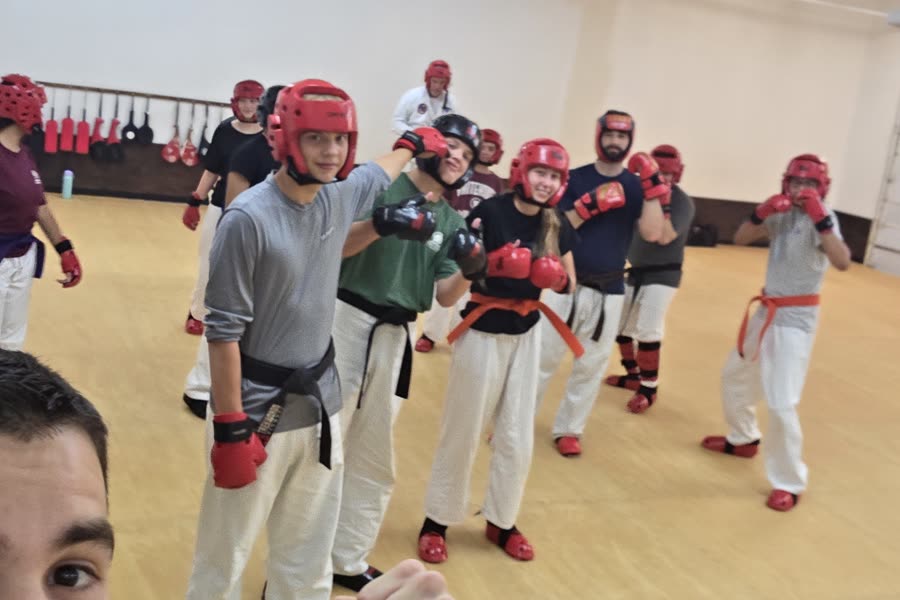 Teens and adults in sparring gear during class at Bares Taekwondo Fitness in Tyler, TX